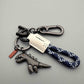 🦖Buy 1 Get 1 Free🎁Aluminum Alloy Dinosaur Charm Paired with a Hand-woven Bracelet